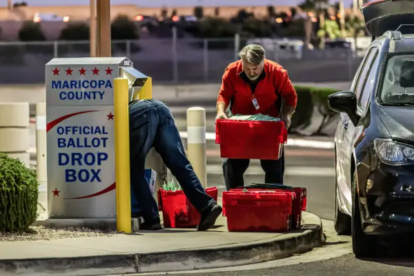 Maricopa County election workers remove ballots from a drop box on Nov. 8, 2022, in Mesa, Arizona. (John Moore/Getty Images)