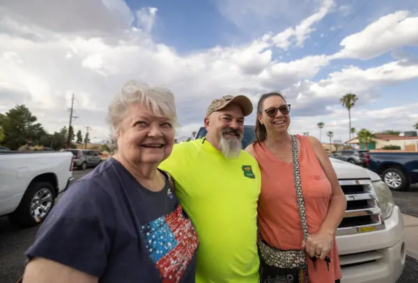 Ann (L), Troy (M), and Trisha (R) Goddard finish the early voting process in Tucson, Arizona, on Oct. 9, 2024. (John Fredricks/The Epoch Times)