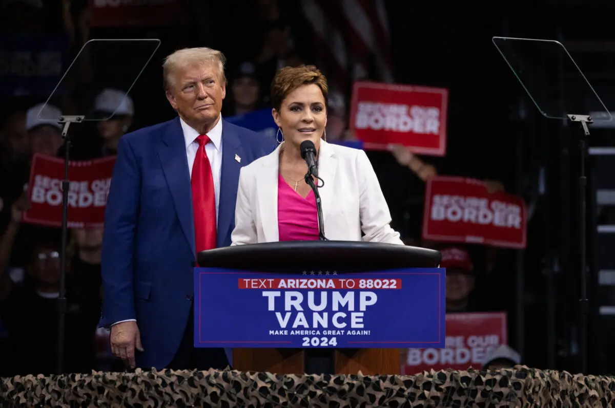 Kari Lake stands next to Republican presidential nominee and former President Donald Trump while speaking to supporters in Prescott Valley, Ariz., on Oct. 13, 2024. (John Fredricks/The Epoch Times)