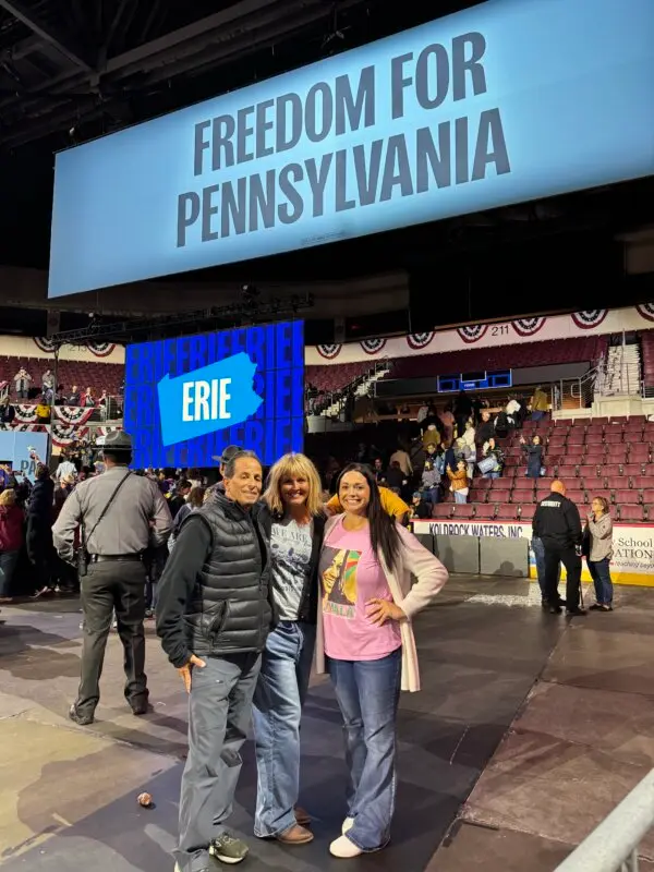 Gary Grack (L), his wife, Patty Pilatus Grack (C), and friend Heather Ulmer at the Erie Insurance Arena, where Vice President Kamala Harris held a rally in Erie, Pa., on Oct. 14, 2024. (Arjun Singh/Epoch Times)