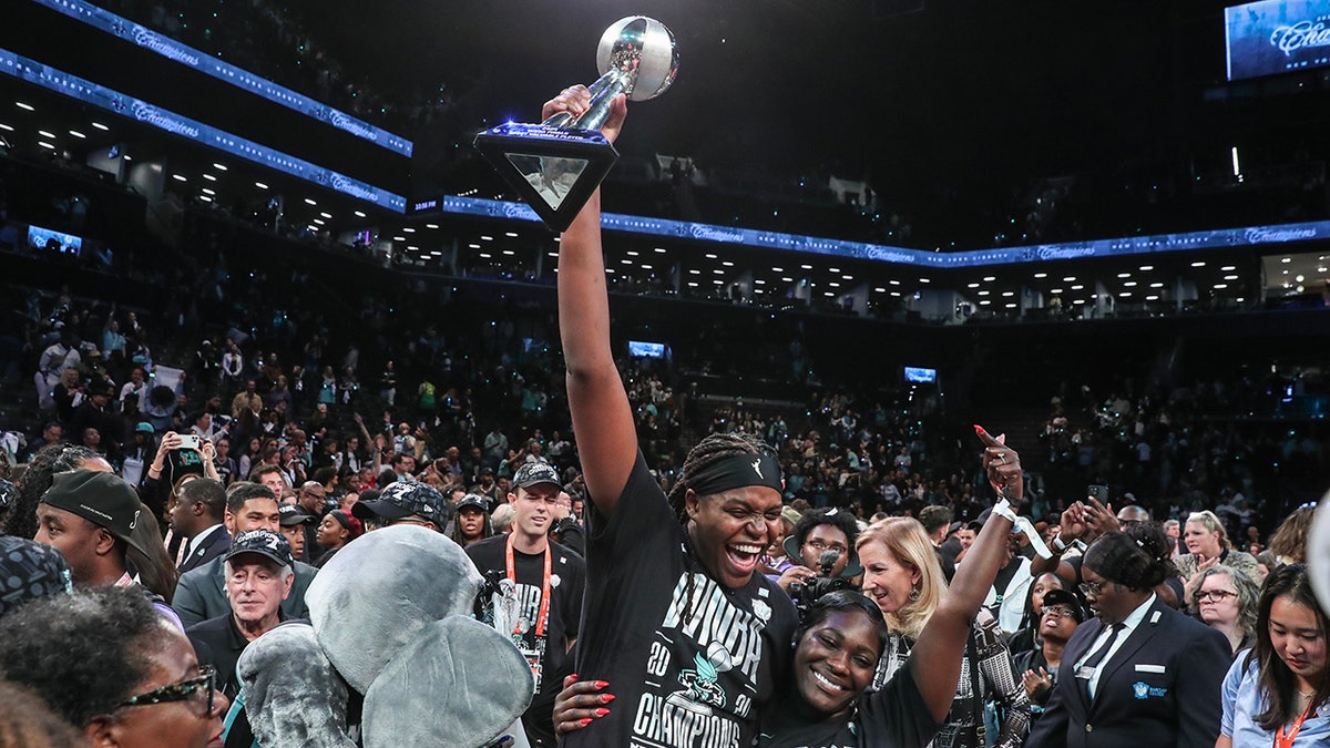 Jonquel Jones lifts WNBA Finals trophy