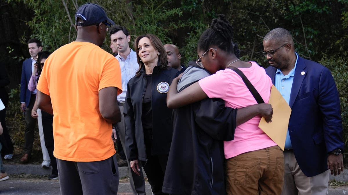 Vice President Kamala Harris greets people who were impacted by Hurricane Helene in Augusta, Georgia, on Oct. 2 as Augusta Mayor Garnett Johnson watches at right.