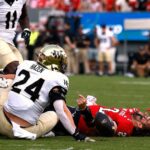 NC State quarterback Grayson McCall carted off the field after scary hit sends helmet flying