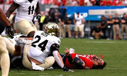 NC State quarterback Grayson McCall carted off the field after scary hit sends helmet flying