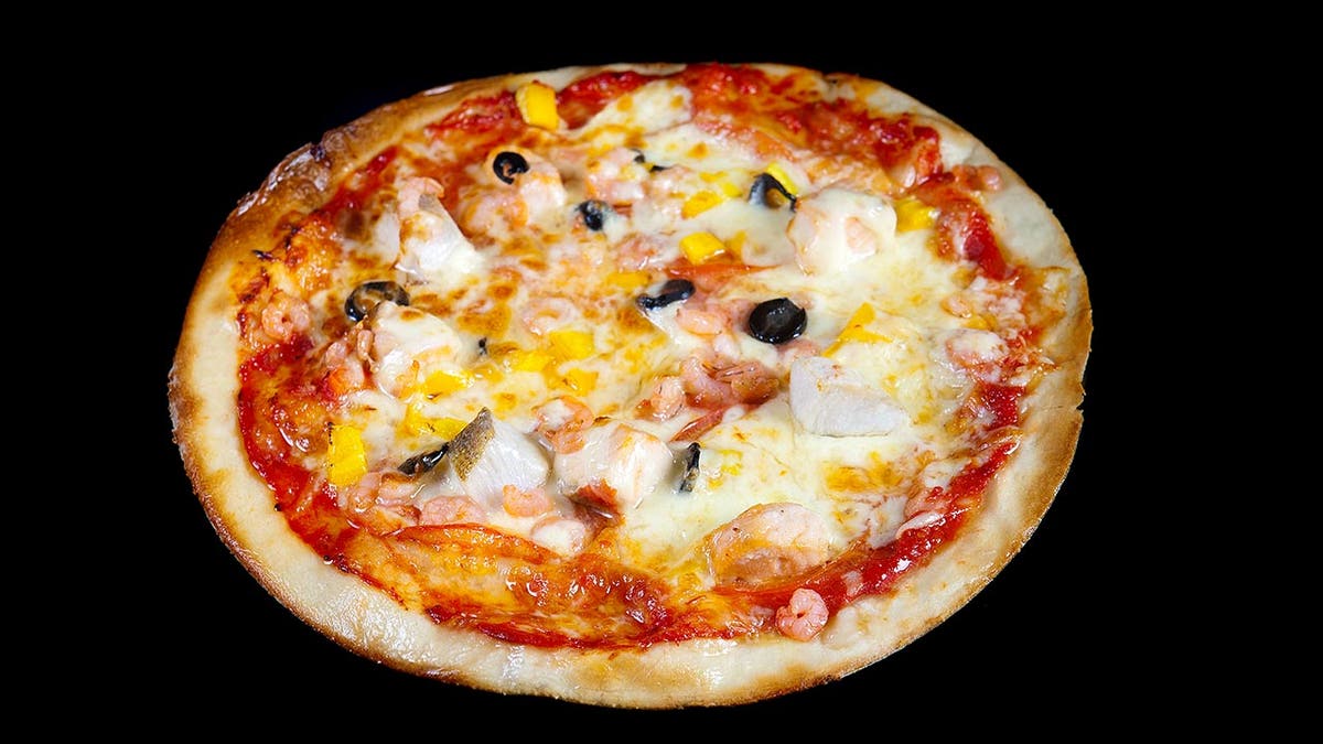 A pizza in Moscow is topped with fish