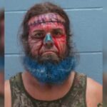 Bearded perp makes it into mugshot Hall of Shame after threatening to bomb beauty store