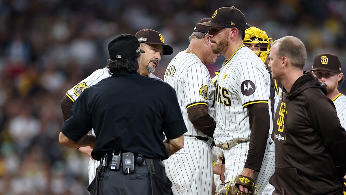 Musgrove with trainer and ump