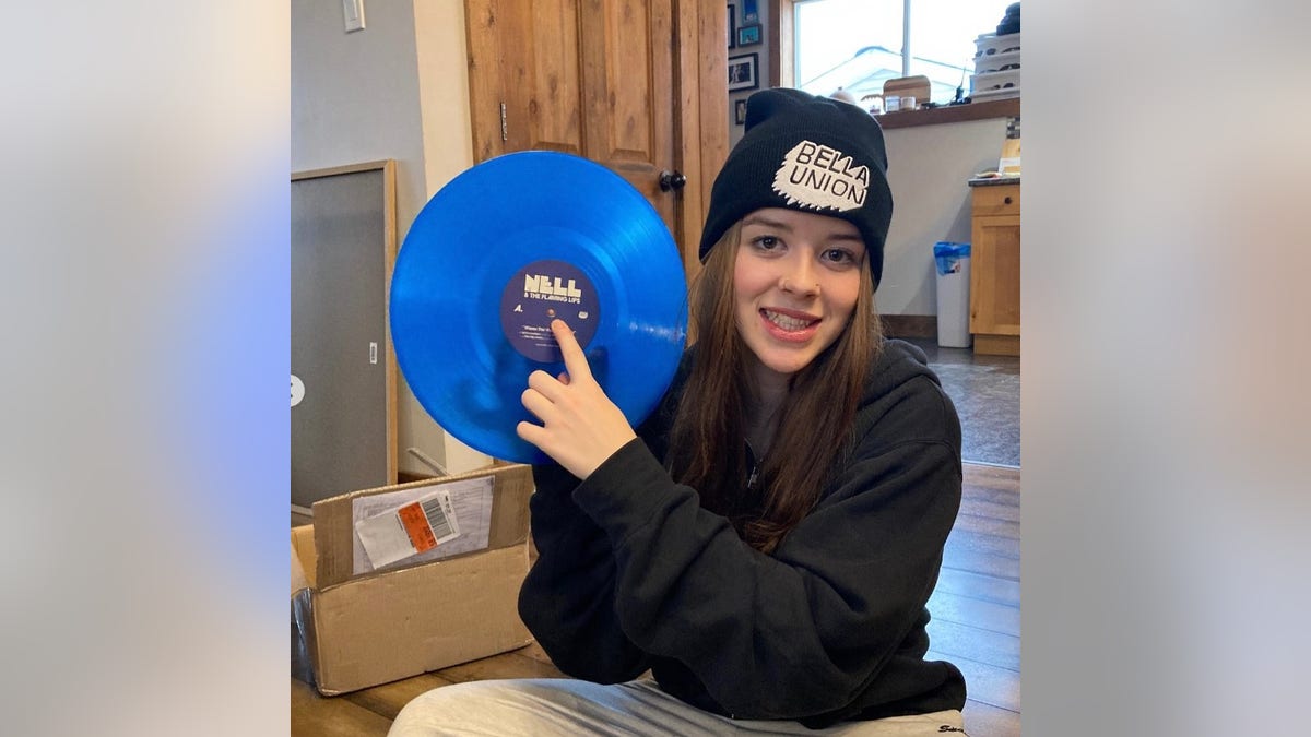 Nell Smith holding a record