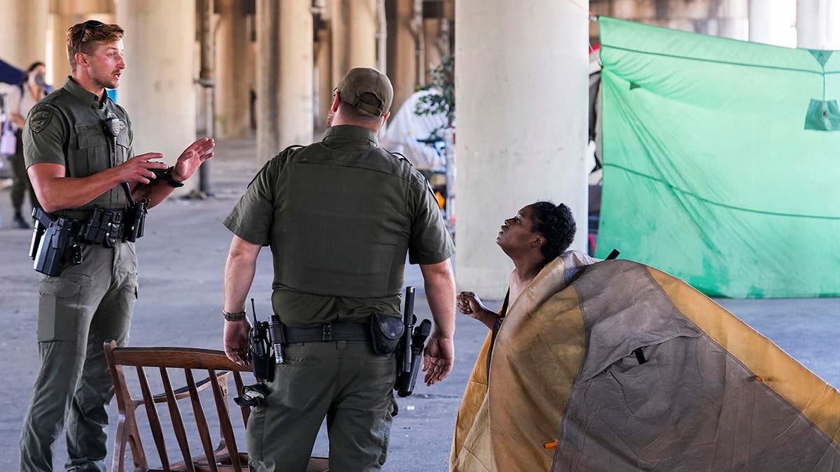 law enforcement at homeless encampment