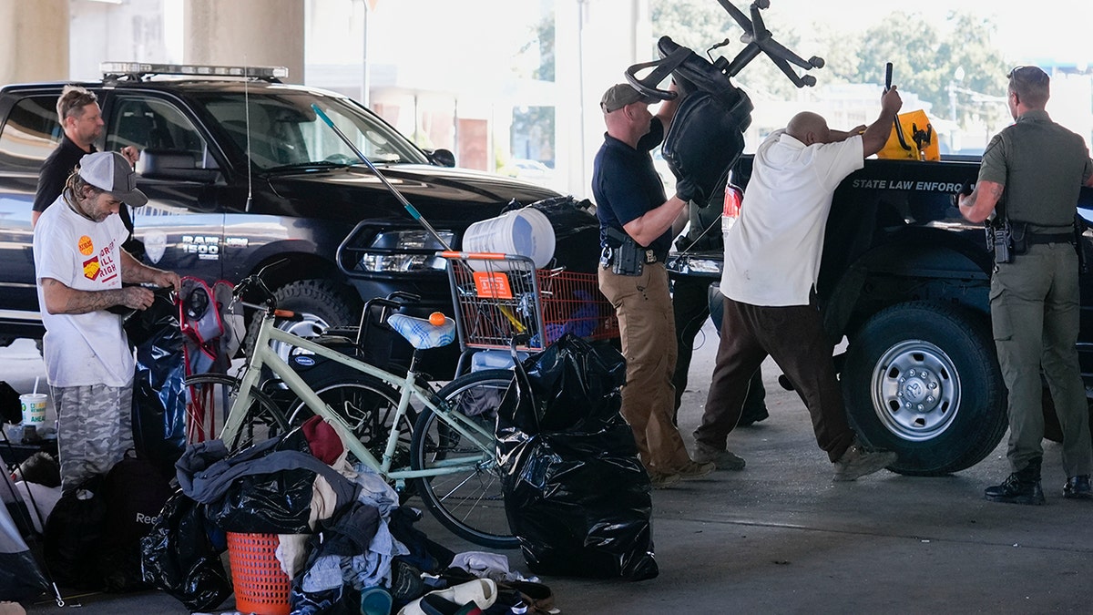 law enforcement at homeless encampment