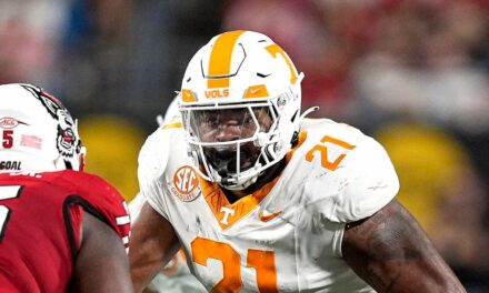 Tennessee player shoves fan storming field to the ground after upset loss to Arkansas