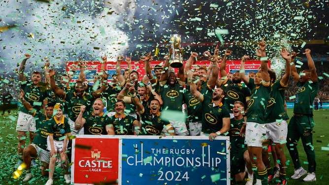 South Africa's flanker Siya Kolisi (C) lifts the trophy as he celebrates with his teammates after they won the Rugby Championship following their match between South Africa and Argentina at Mbombela Stadium in Mbombela on September 28, 2024. (Photo by PHILL MAGAKOE / AFP) (Photo by PHILL MAGAKOE/AFP via Getty Images)