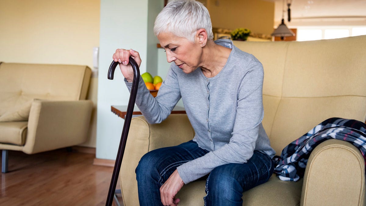 Senior woman with cane