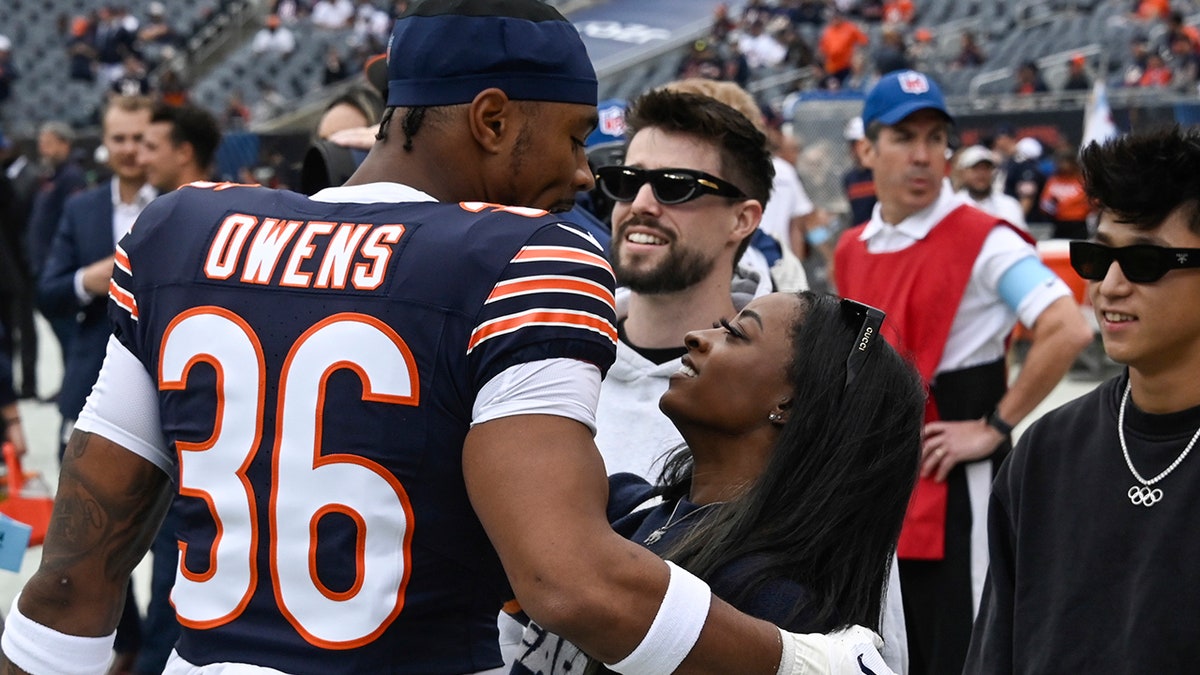 Simone Biles and Jonathan Owens before Bears game