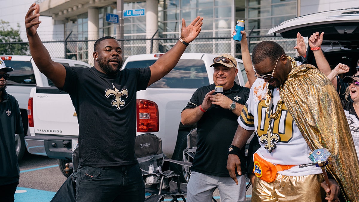 Spice Adams and Mark Ingram at tailgate