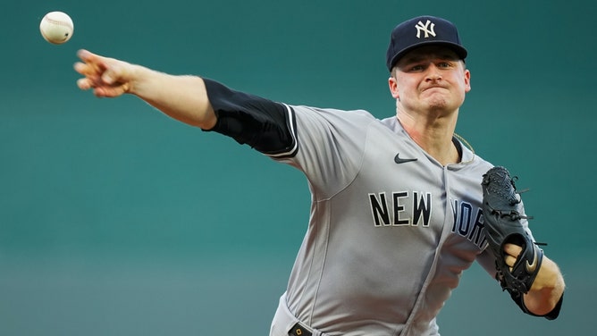 New York Yankees starting pitcher Clarke Schmidt warms up against the Kansas City Royals at Kauffman Stadium. (Jay Biggerstaff-Imagn Images)