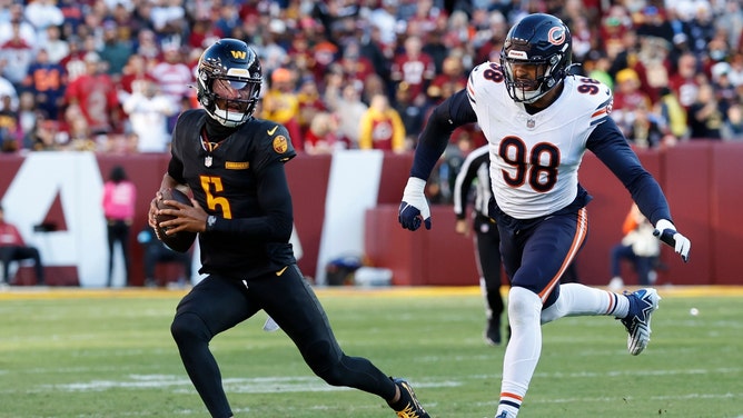 Washington Commanders QB Jayden Daniels scrambles against the Chicago Bears in NFL Week 8. (Geoff Burke-Imagn Images)