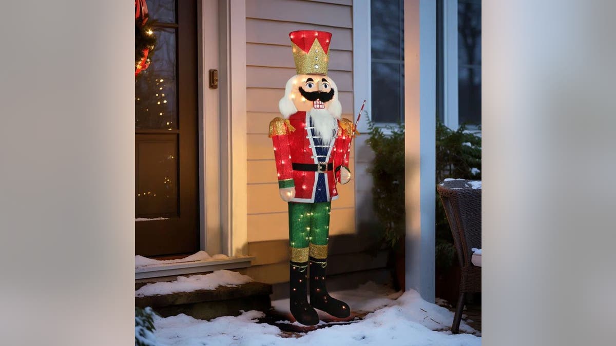 Add a nutcracker to your outside Christmas decorations.