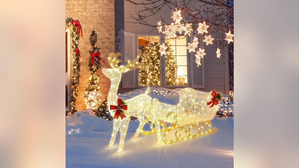 This pre-lit reindeer and Santa's sleigh decoration set brings the wow factor.