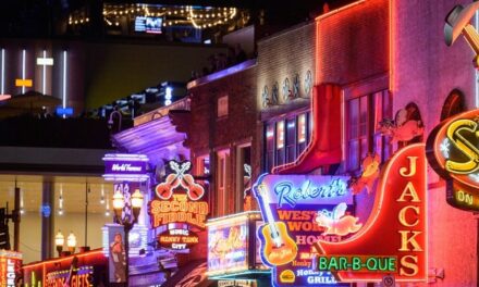 Ladies Enjoying A Night Out In Nashville Hop On A Police Car For The Perfect Picture Of Them Kissing