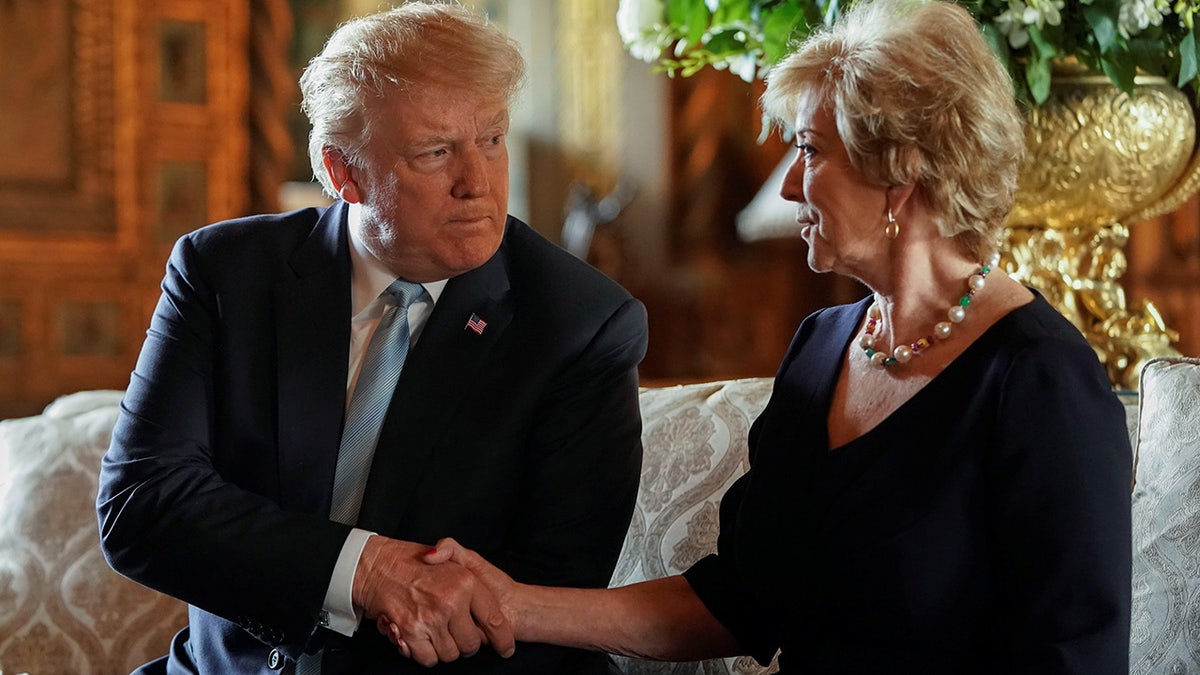 Trump shaking Linda McMahon's hand