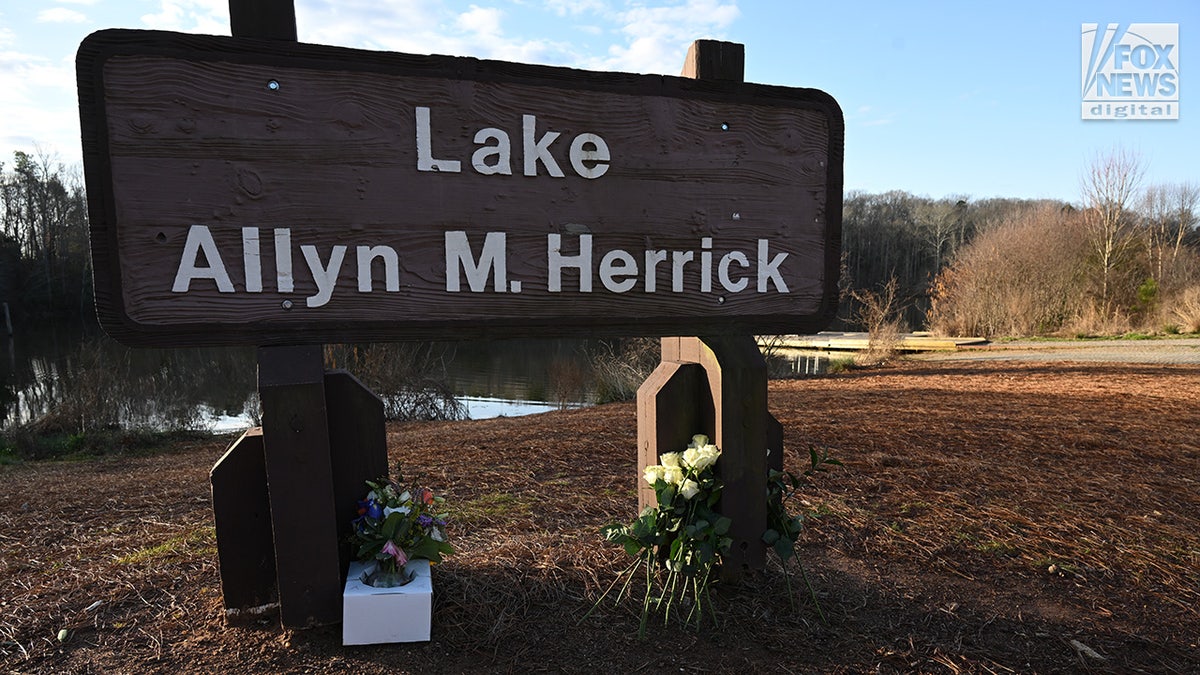 A memorial for Laken Riley is seen along Lake Herrick on the University of Georgia’s campus