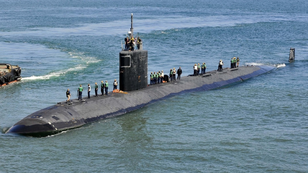 PUERTO PRINCESSA, Philippines - (Dec. 9, 2018) - The Los Angeles-class attack submarine USS Greenville (SSN 772) prepares to moor alongside the submarine tender USS Emory S. Land (AS 39), Dec. 9. Emory S. Land is a forward-deployed expeditionary submarine tender on an extended deployment conducting coordinated tended moorings and afloat maintenance in the U.S. 5th and 7th Fleet areas of operations. (U.S. Navy photo by Mass Communication Specialist 2nd Class Daniel Willoughby/RELEASED)