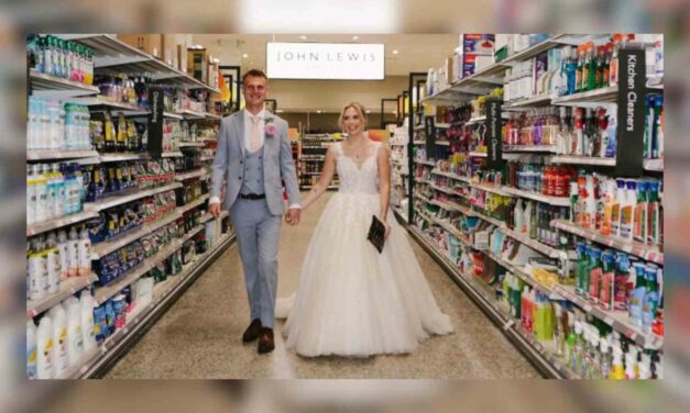 Newlyweds return to the grocery store where they met to take wedding photos