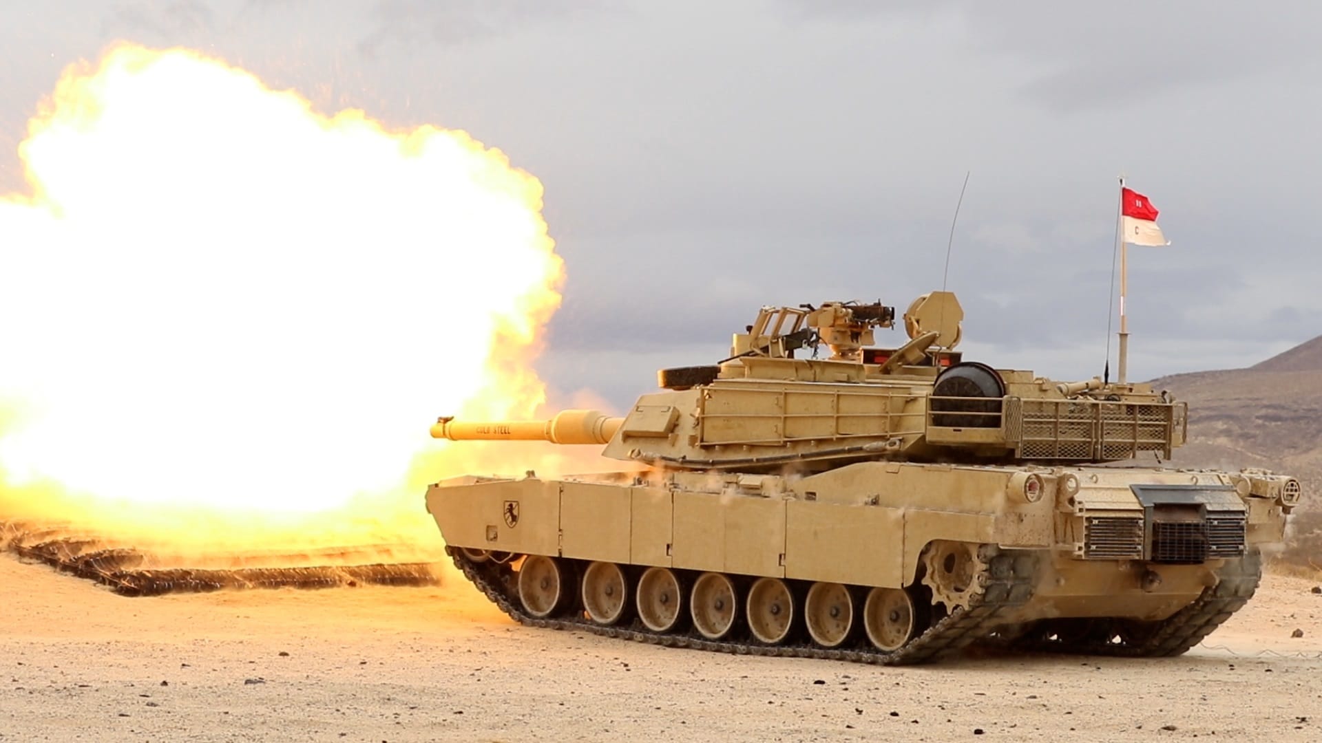 An M1A2 Abrams SEP V2 main battle tank, assigned to Cold Steel Troop, 1st Squadron, 11th Armored Cavalry Regiment, fires a M865 target practice cone stabilized discarding sabot with tracer on December 9, 2021, at the National Training Center and Fort Irwin training area. Image: Creative Commons.