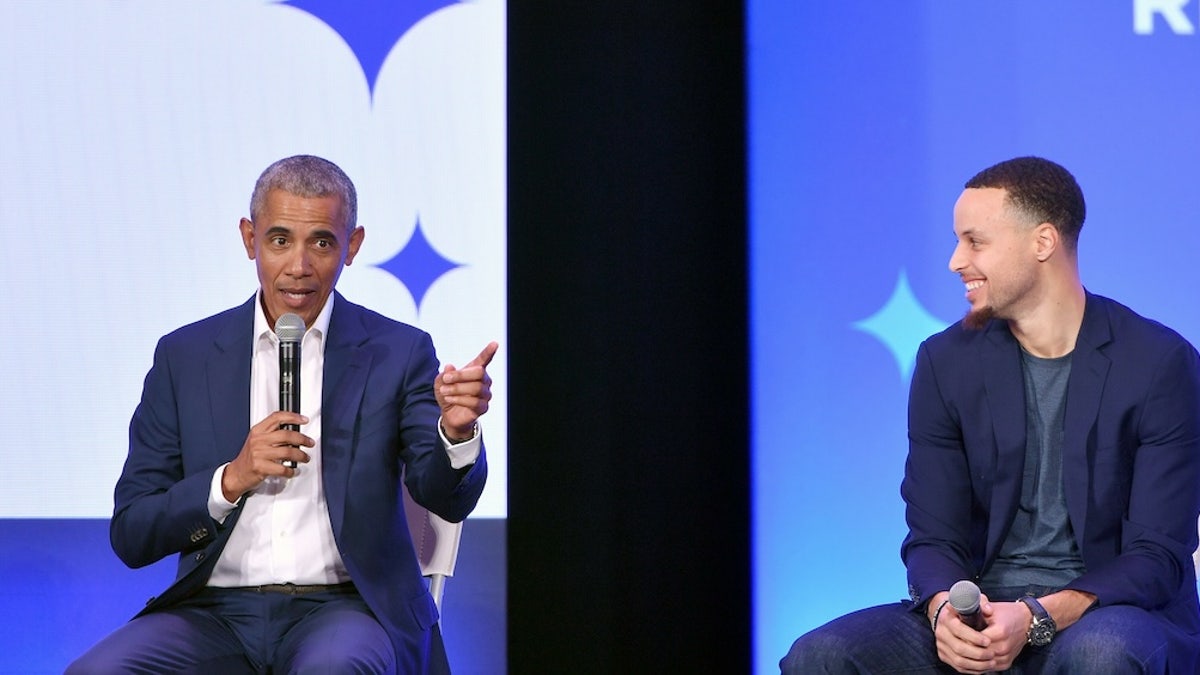 Former President Barack Obama speaks alongside Golden State Warriors basketball player Stephen Curry during the MBK Rising! My Brother's Keeper Alliance Summit in Oakland, California on February 19, 2019. 