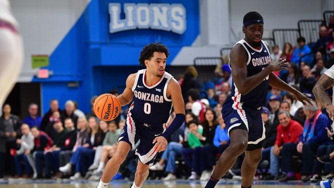 Gonzaga Bulldogs PG Ryan Nembhard drives the ball up the floor on the Loyola Marymount Lions with forward Graham Ike at Gersten Pavilion. (Gary A. Vasquez-USA TODAY Sports)