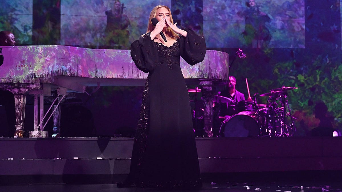 Adele blowing a kiss to the audience