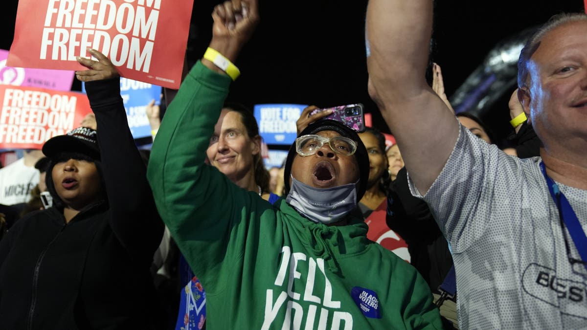 Attendees cheer as Democratic vice presidential nominee Minnesota Gov. Tim Walz speaks at a campaign rally, Monday, Nov. 4, 2024, in Detroit.