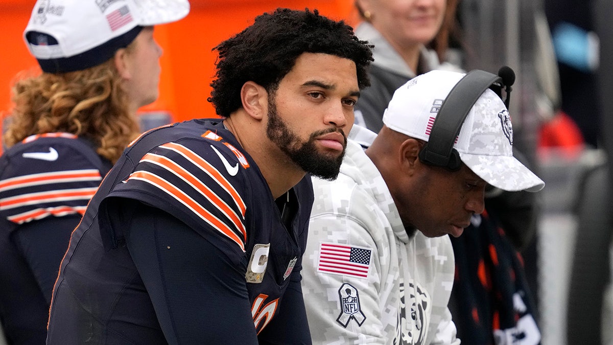 Caleb Williams sits on the bench