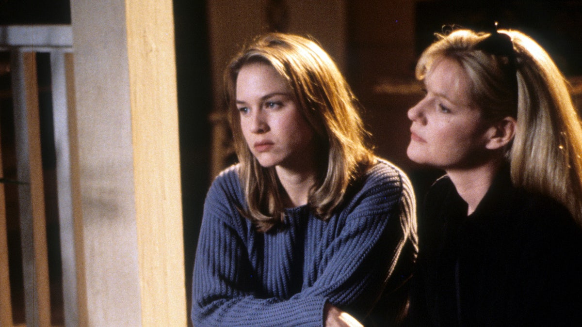 Renée Zellweger and Bonnie Hunt sit on a porch in a scene from 