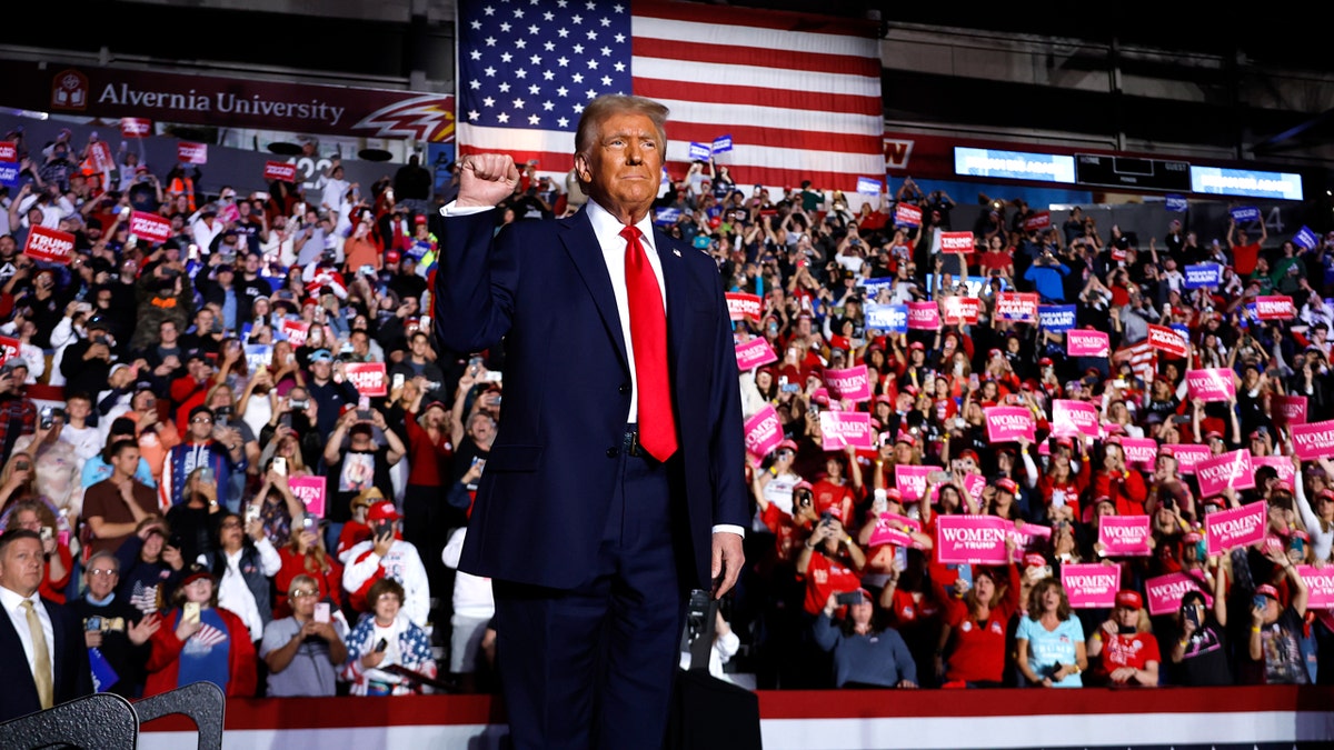 READING, PENNSYLVANIA - NOVEMBER 04: Republican presidential nominee, former President Donald Trump holds up a fist at a campaign rally at the Santander Arena on November 04, 2024 in Reading, Pennsylvania. With one day left before the general election, Trump is campaigning for re-election in the battleground states of North Carolina, Pennsylvania and Michigan.