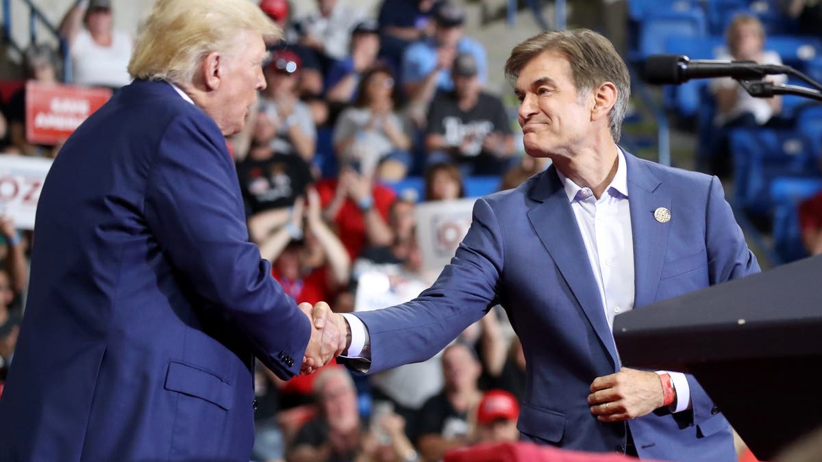 Donald Trump shakes hands with Dr. Mehmet Oz