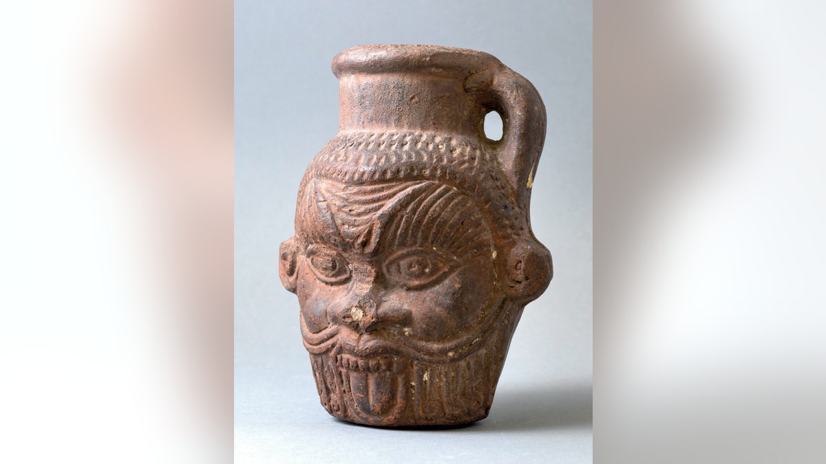 Drinking vessel in the shape of a Bes head