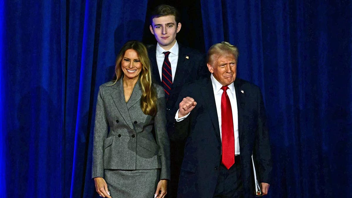 Donald Trump with his wife and son arrive to make a victory speech after winning the 2024 election