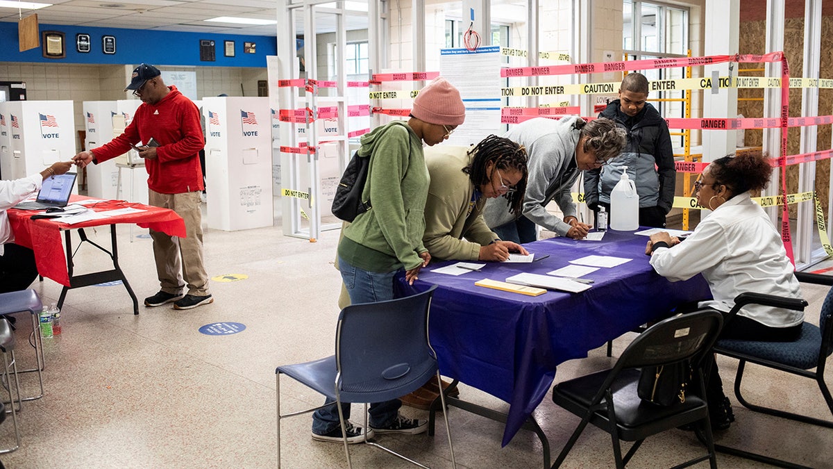 Voters arrive to cast their ballots in the 2024 U.S. presidential election