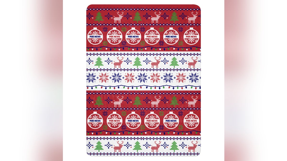 Stay warm and cozy with this super soft Christmas blanket. 