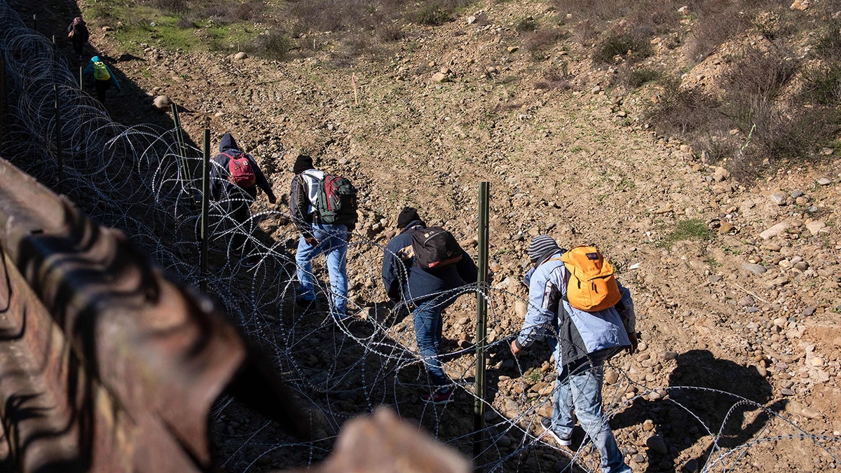 Migrants crossing US border