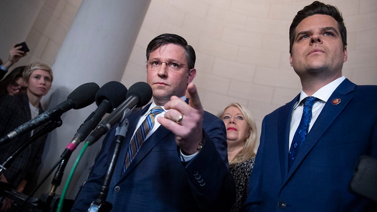 Rep. Mike Johnson, R-La., center, Matt Gaetz, R-Fla., at a news conference. 