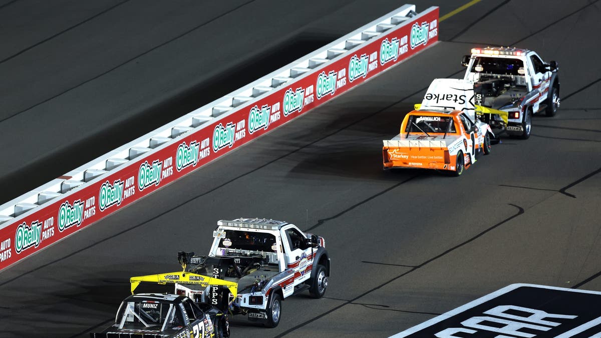  The #27 More Core Diamond Drilling Ford, driven by Frankie Muniz and the #1 Starkey/Soundgear Toyota, driven by William Sawalich are towed after an on-track incident during the NASCAR Craftsman Truck Series Championship Race 