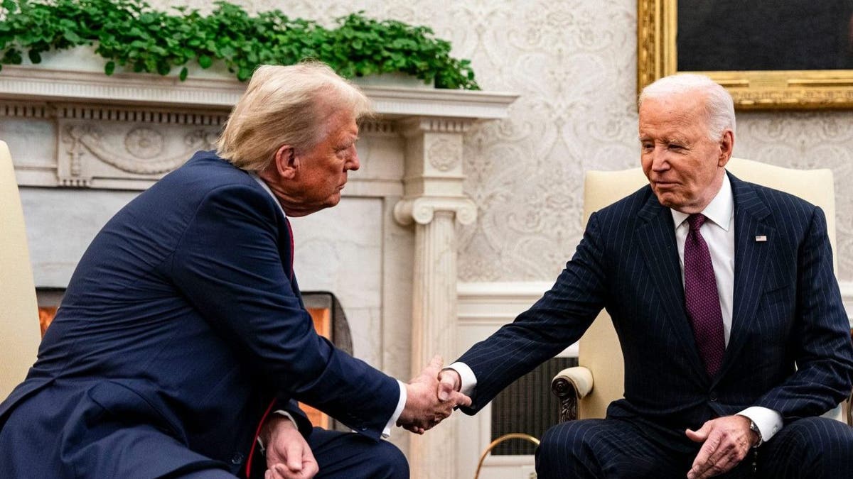 Trump and Biden closeup shot shaking hands in Oval Office