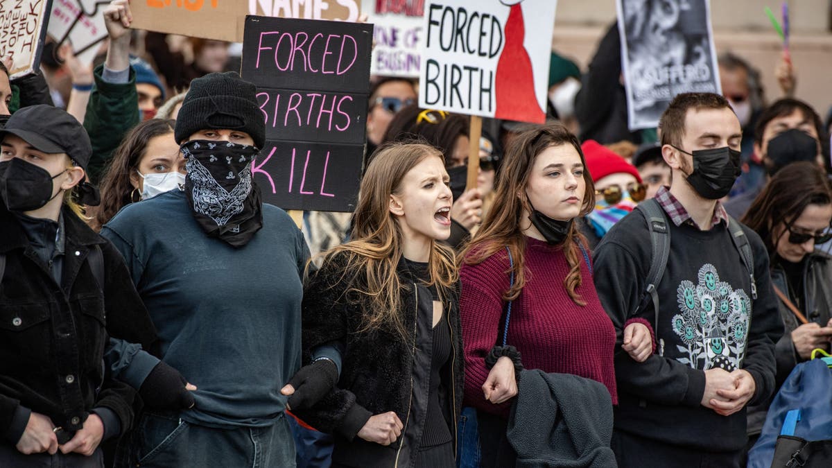 Counterprotesters try to block the National Men's March to abolish abortion and rally for personhood in Boston on Nov. 16, 2024.