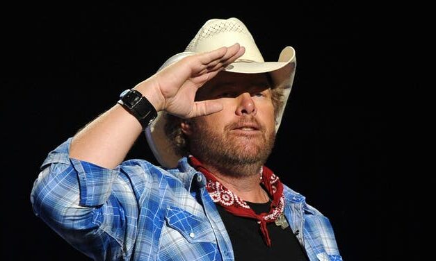 Country Music Star Leads Packed Football Stadium In Chilling Toby Keith Tribute: WATCH