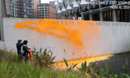 Climate activists spray US embassy in London with orange paint after Trump reelection victory