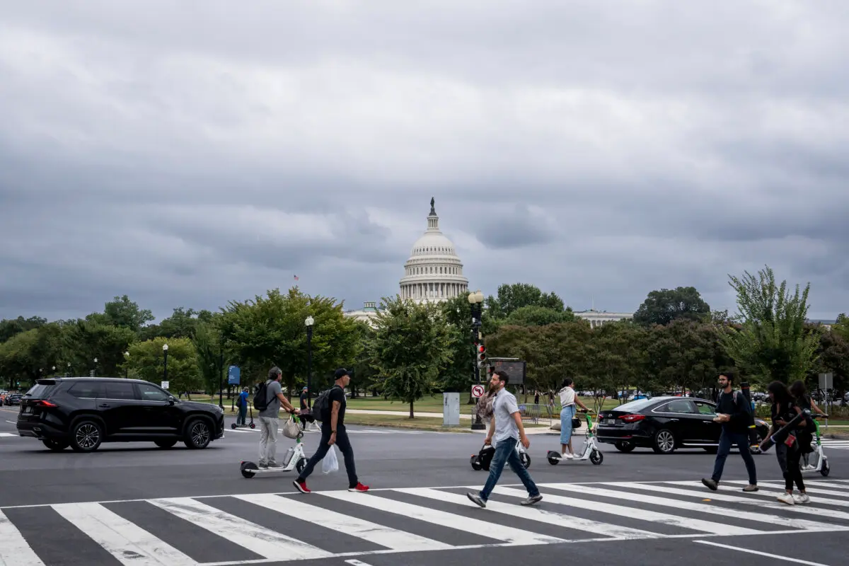 People cross a street near the U.S. Capitol in Washington on Sept. 16, 2024. (Madalina Vasiliu/The Epoch Times)