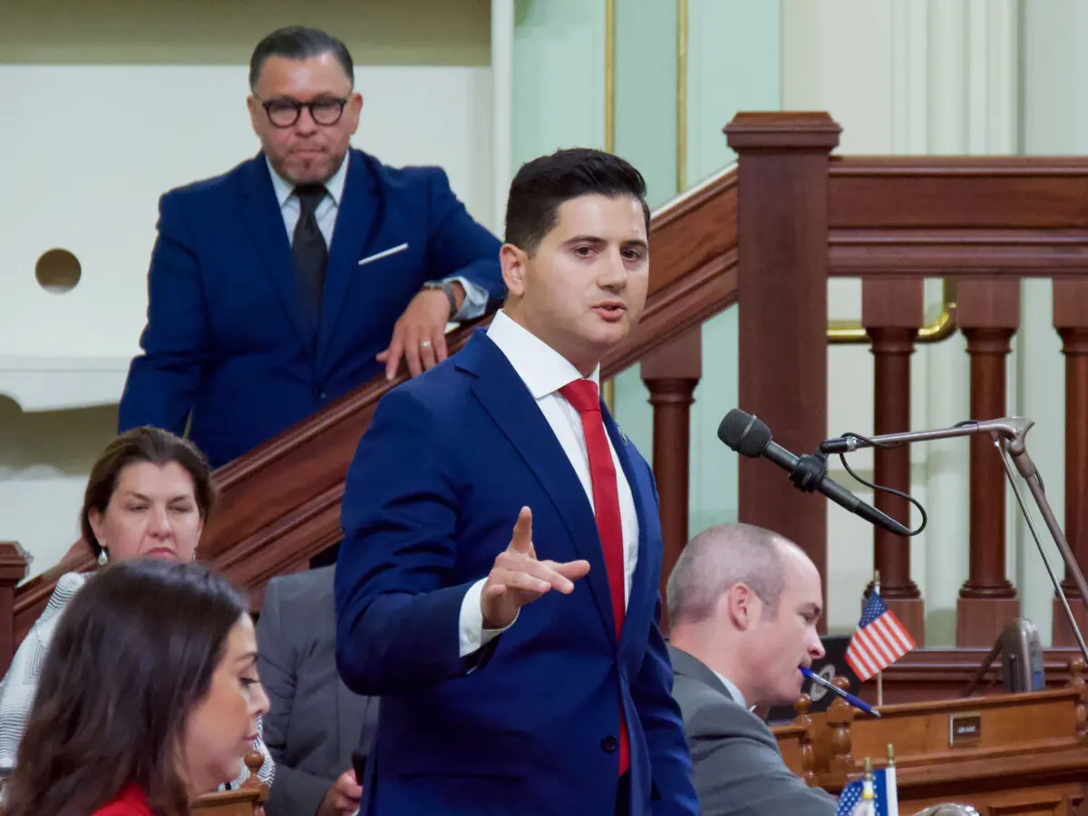 Assemblyman Bill Essayli addresses the Legislature on the floor of the Assembly at the Capitol in Sacramento, Calif., on Aug. 31, 2024. (Travis Gillmore/The Epoch Times)